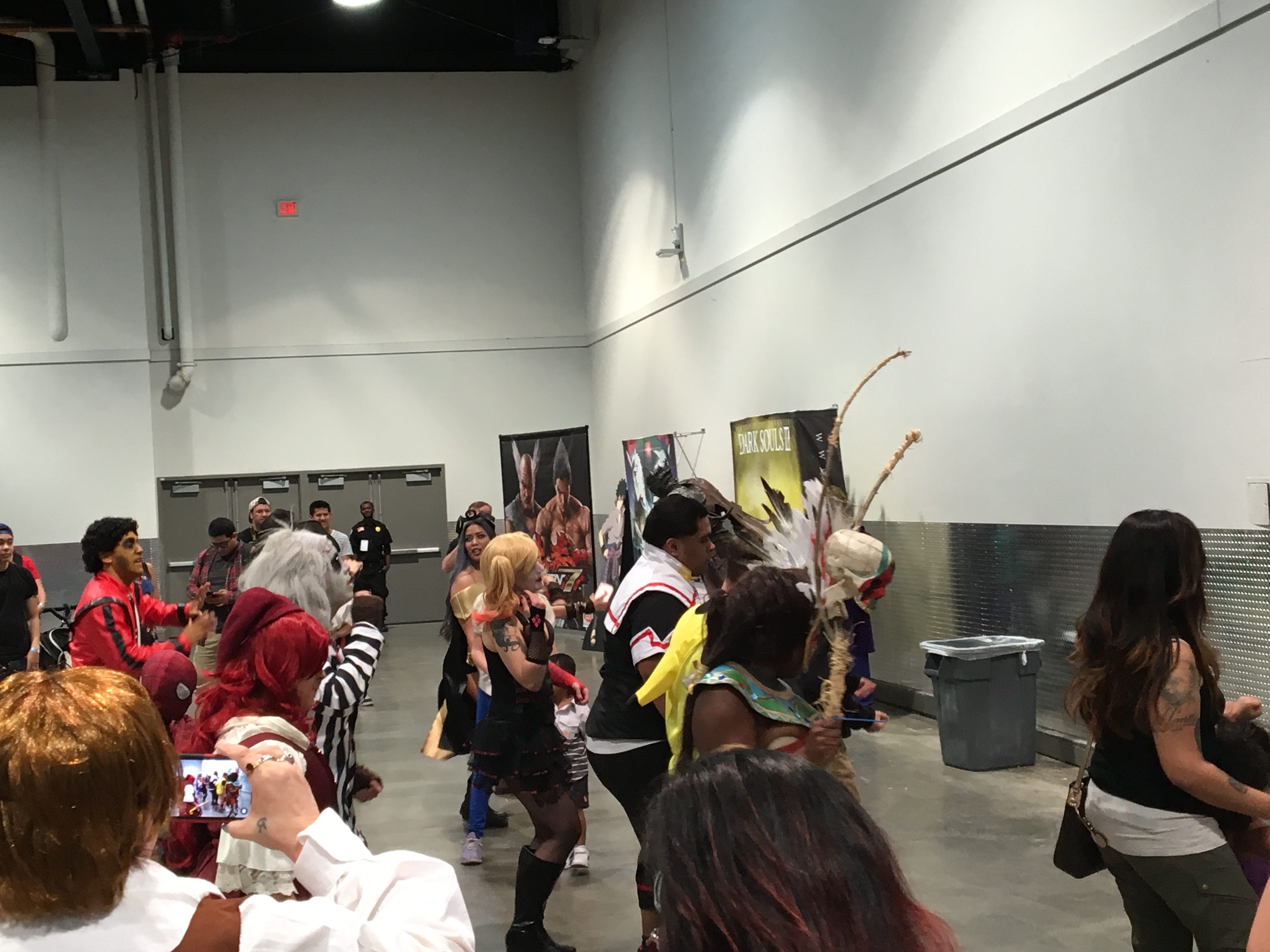 Cosplayers gather and dance together to the wobble, as many others are entertained