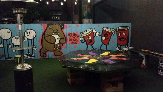 An overview of the beer pong area at gold spike social club